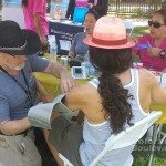 Jan Divine, RN, takes the blood pressure of a participant @ SGV Pride -2014