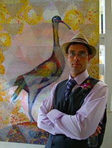 Just Kibbe in front of a painting by Susan Dobay