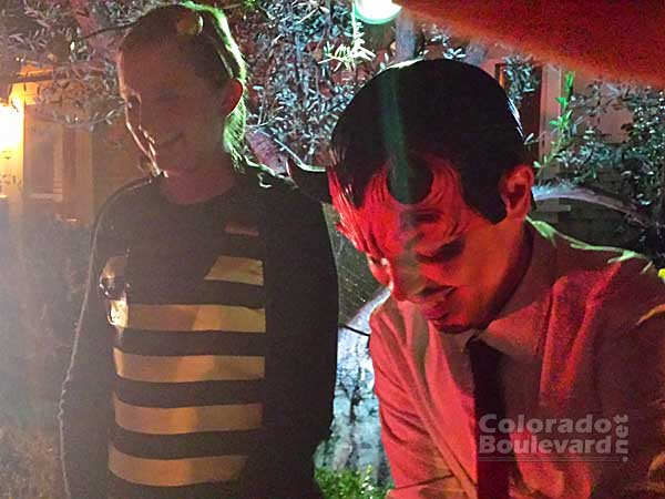 Satan (Adam) and his innocent looking bee helper (Emily) serving the little goblins.