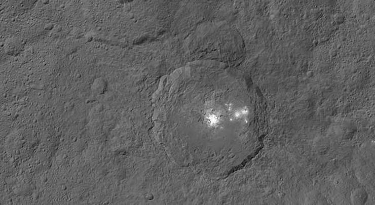This mosaic shows Ceres' Occator crater and surrounding terrain from an altitude of 915 miles, as seen by Dawn spacecraft (Photo - NASA/JPL-Caltech/UCLA/MPS/DLR/IDA)